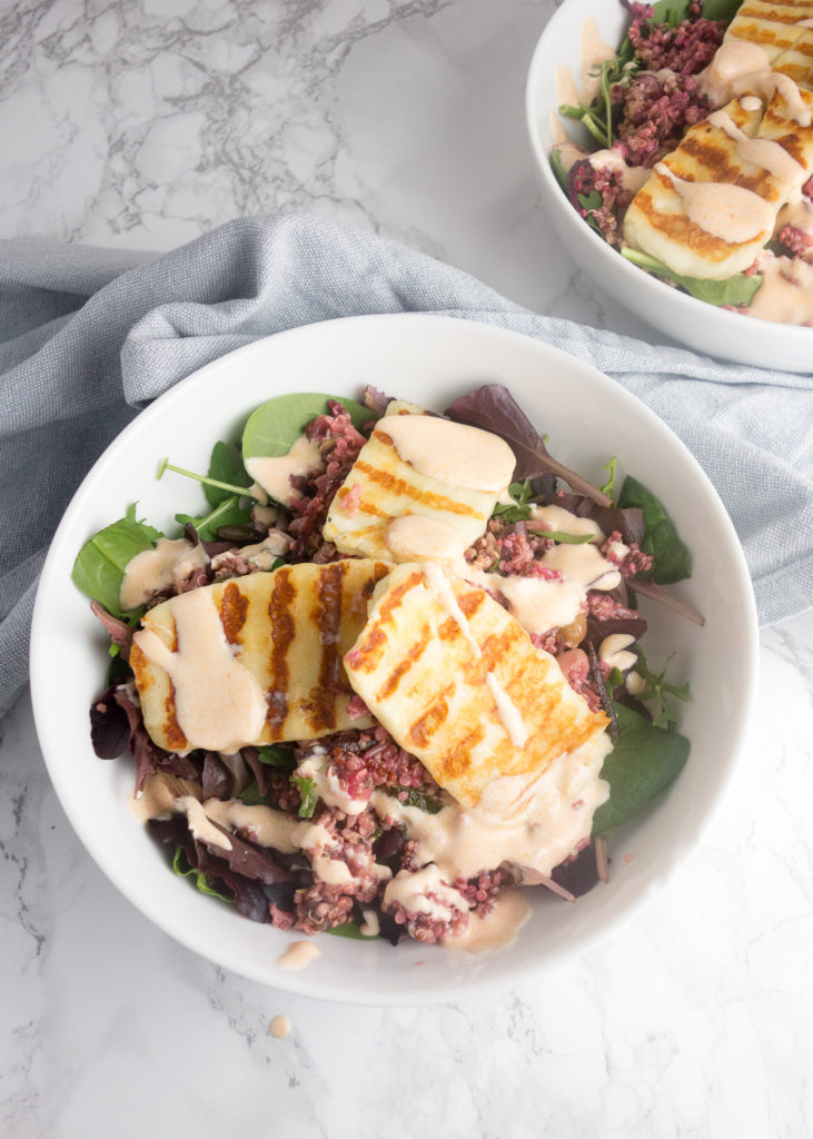 Halloumi Grain Salad: A simple vegetarian recipe for a filling salad topped with salty halloumi & a creamy sriracha yoghurt dressing. So delicious!