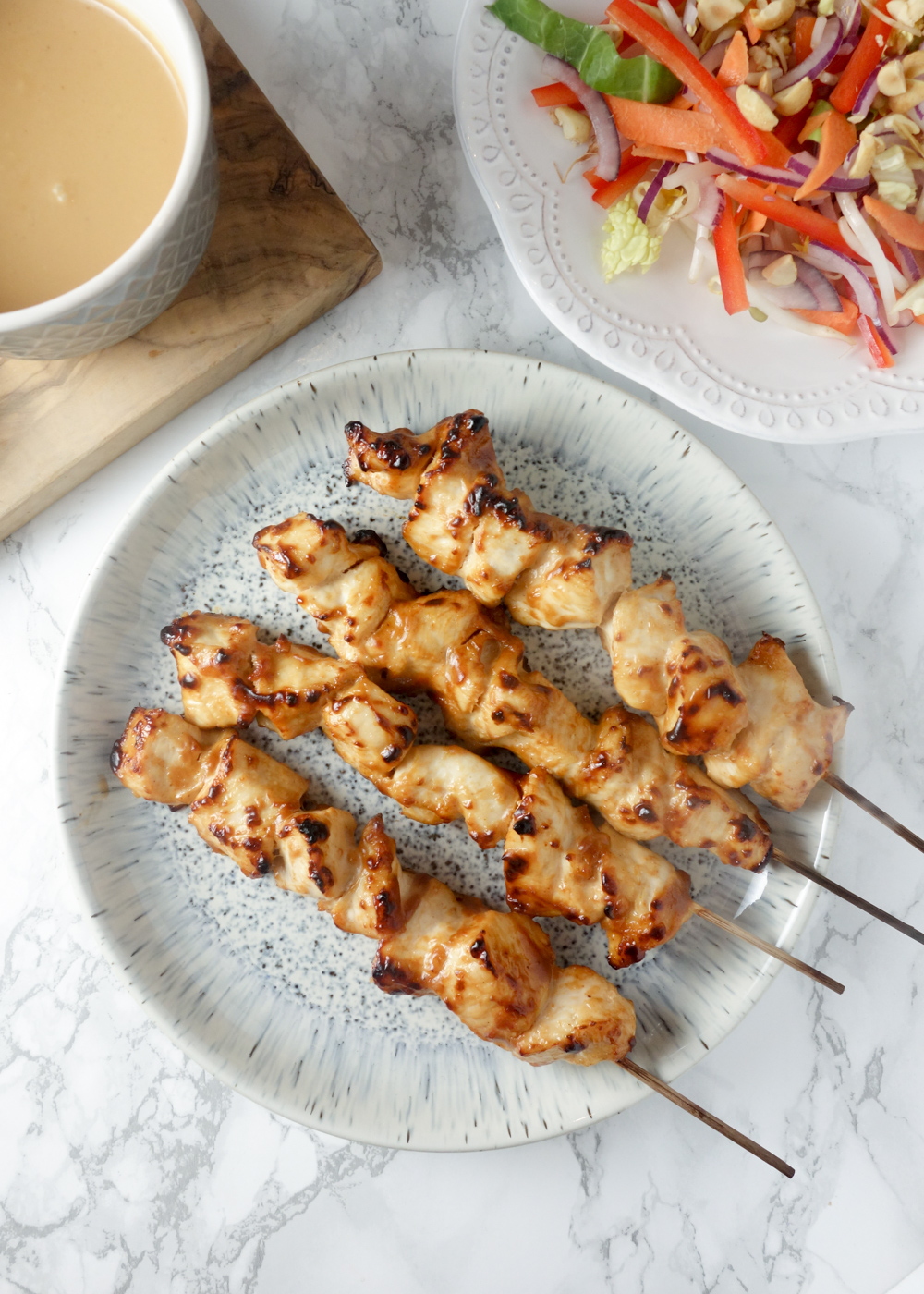 A quick & easy recipe for chicken satay skewers with a creamy, nutty peanut dipping sauce. SO tasty!
