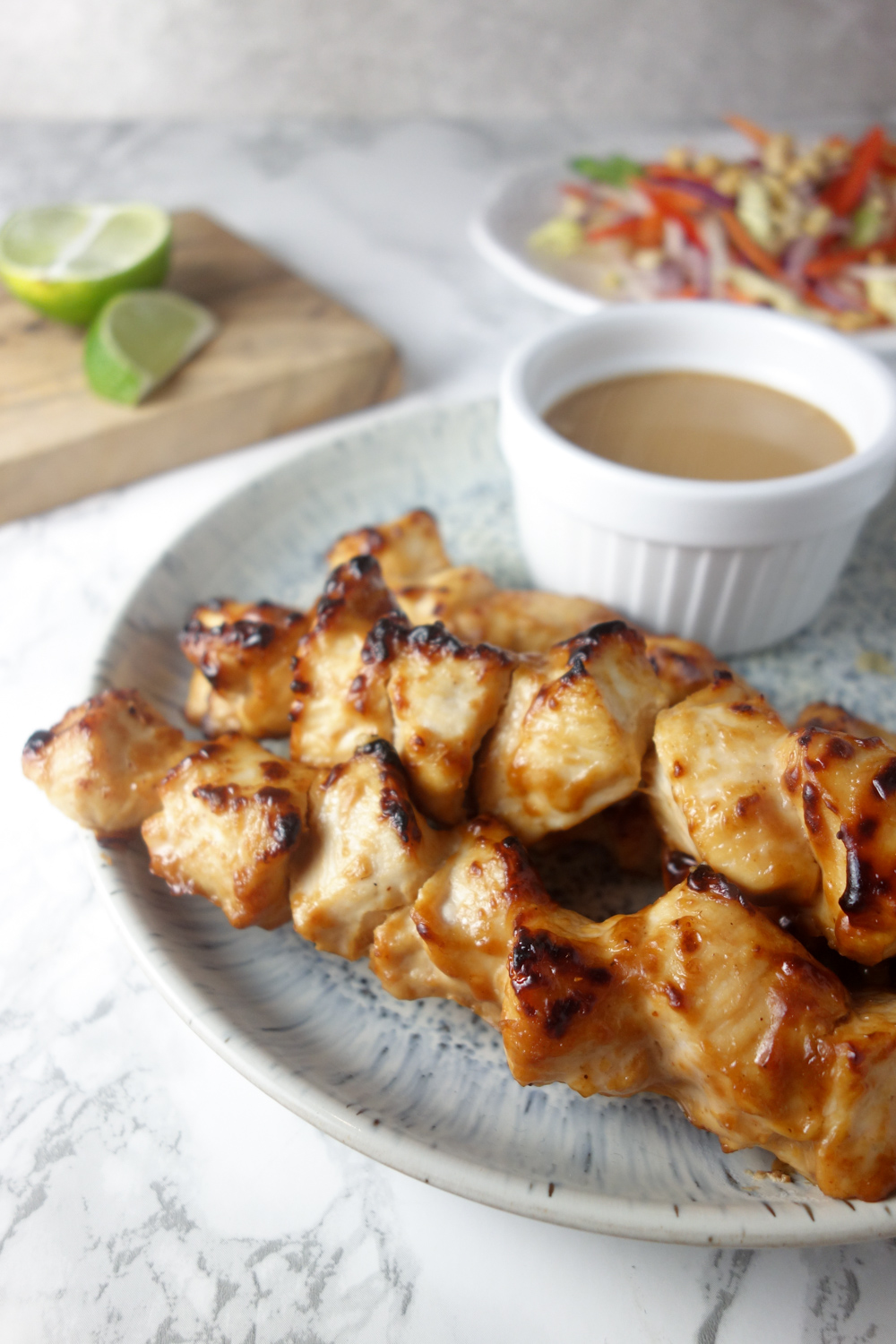 A quick & easy recipe for chicken satay skewers with a creamy, nutty peanut dipping sauce. SO tasty!