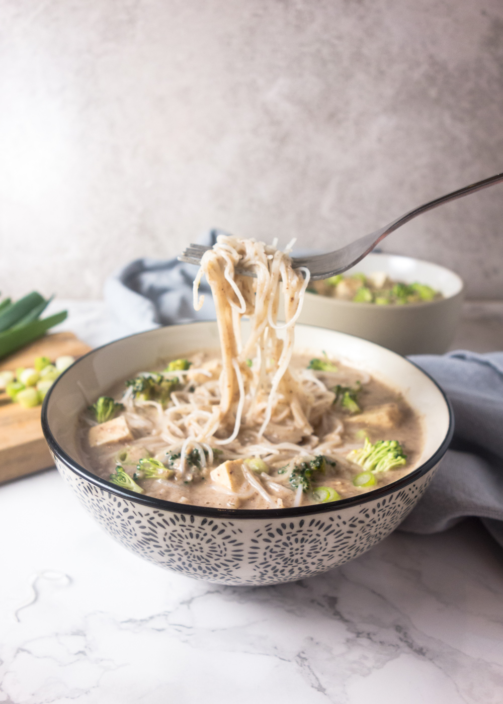 Peanut Miso Noodle Soup: Tofu and noodles in a rich, nutty miso broth makes a deliciously savoury comforting meal that's quick & easy to cook.